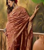 copper rose banarasi jacquard saree with intricate zari weaving & tassel pallu     unstitched blouse