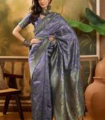 lavender banarasi jacquard saree with elegant zari weaving & tassel pallu     unstitched blouse