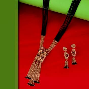 gold tone temple style long mangalsutra set with flower motifs 1