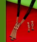 gold tone temple style long mangalsutra set with flower motifs