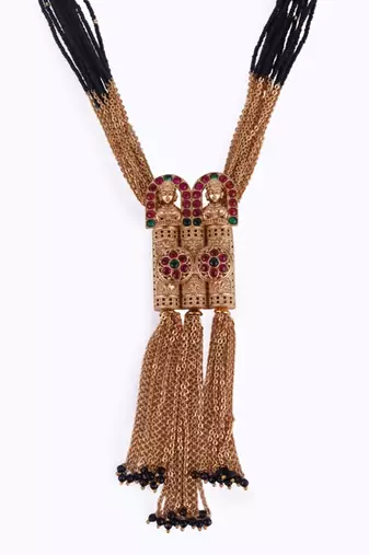 gold tone temple style long mangalsutra set with flower motifs