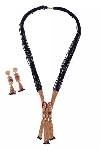 gold tone temple style long mangalsutra set with flower motifs