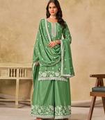 Green heavy chinon semi stitched palazzo suit with embroidey work