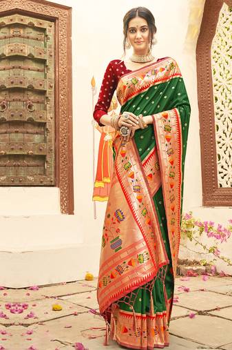 Dark green color silk blended heavy woven designer ethnic partywear saree