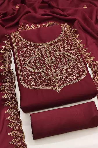Graceful embroidered suit set featuring intricate zari work and a delicately bordered dupatta