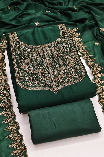 Graceful embroidered suit set featuring intricate zari work and a delicately bordered dupatta
