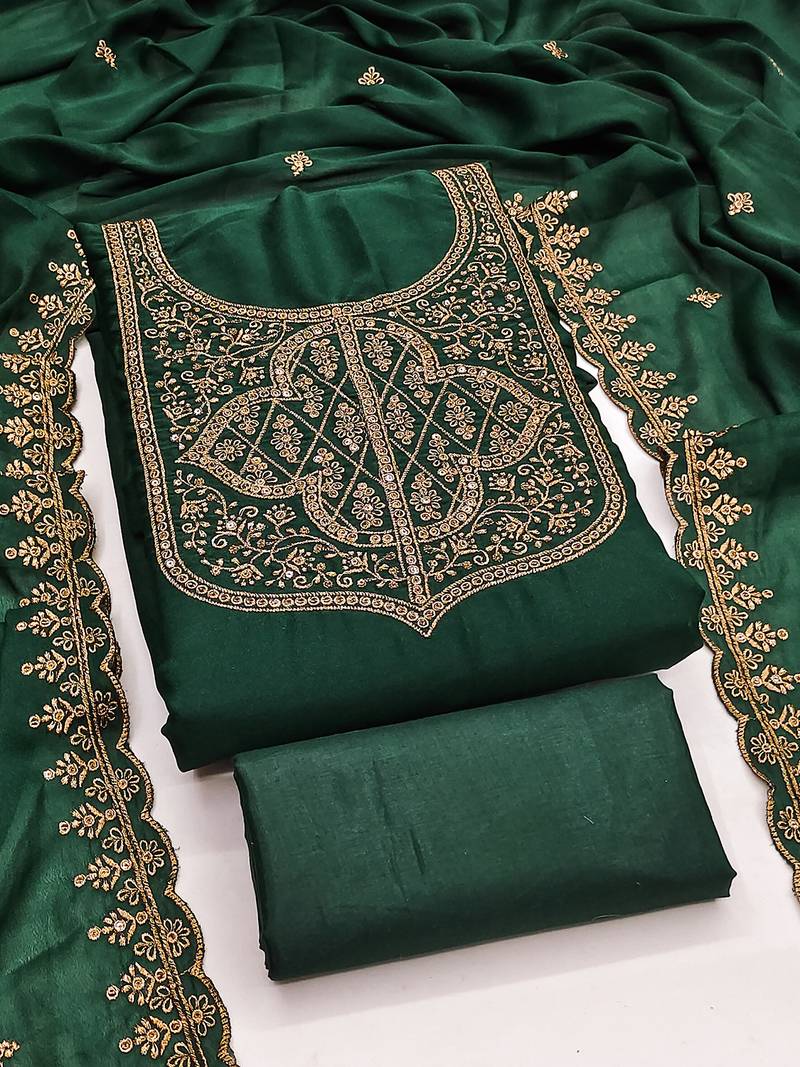 Graceful embroidered suit set featuring intricate zari work and a delicately bordered dupatta