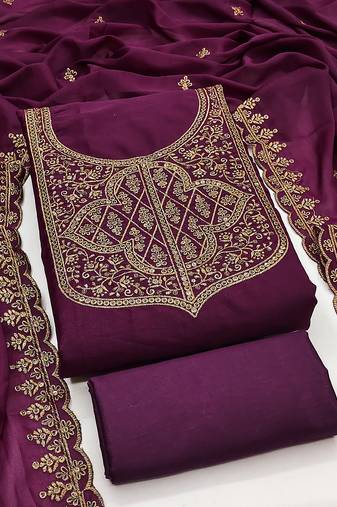 Graceful embroidered suit set featuring intricate zari work and a delicately bordered dupatta