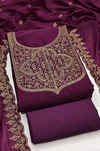 Graceful embroidered suit set featuring intricate zari work and a delicately bordered dupatta