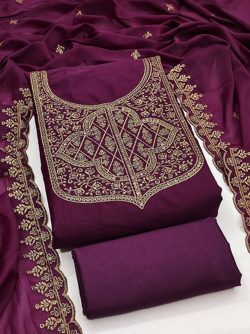 Graceful embroidered suit set featuring intricate zari work and a delicately bordered dupatta