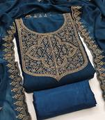 Graceful embroidered suit set featuring intricate zari work and a delicately bordered dupatta