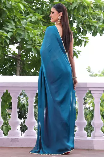 Teal chiffon heavy ceremonial wear saree