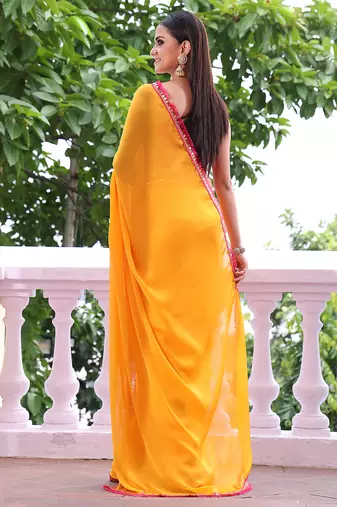 Yellow chiffon heavy ceremonial wear saree