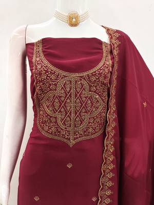Graceful embroidered suit set featuring intricate zari work and a delicately bordered dupatta 4