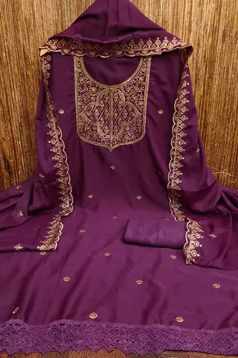 Graceful embroidered suit set featuring intricate zari work and a delicately bordered dupatta