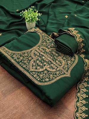 Graceful embroidered suit set featuring intricate zari work and a delicately bordered dupatta 2