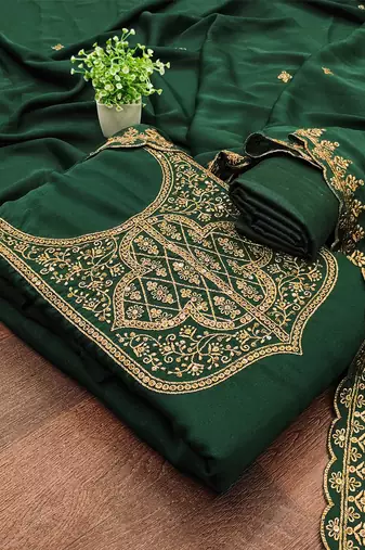 Graceful embroidered suit set featuring intricate zari work and a delicately bordered dupatta