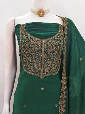 Graceful embroidered suit set featuring intricate zari work and a delicately bordered dupatta 4