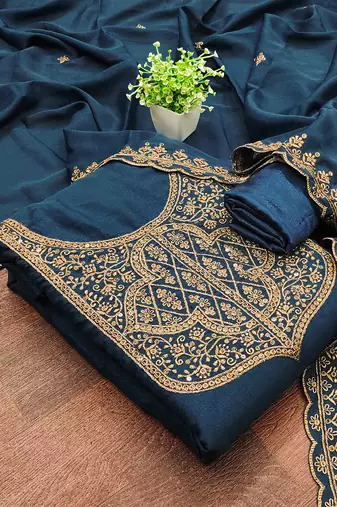 Graceful embroidered suit set featuring intricate zari work and a delicately bordered dupatta