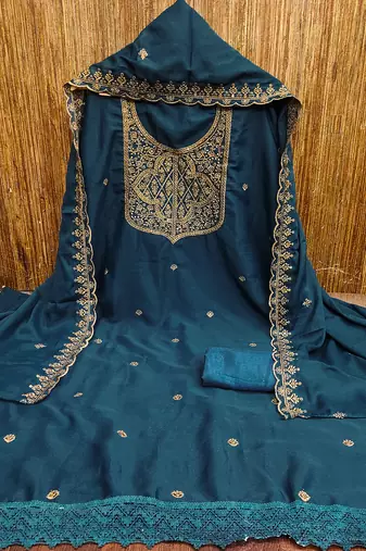 Graceful embroidered suit set featuring intricate zari work and a delicately bordered dupatta
