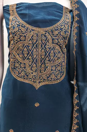 Graceful embroidered suit set featuring intricate zari work and a delicately bordered dupatta