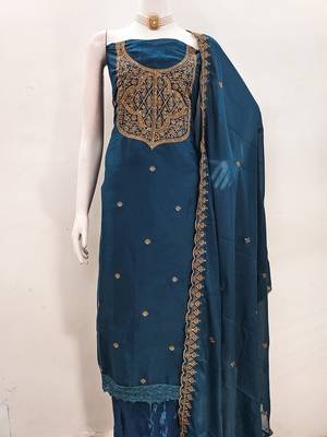 Graceful embroidered suit set featuring intricate zari work and a delicately bordered dupatta 5
