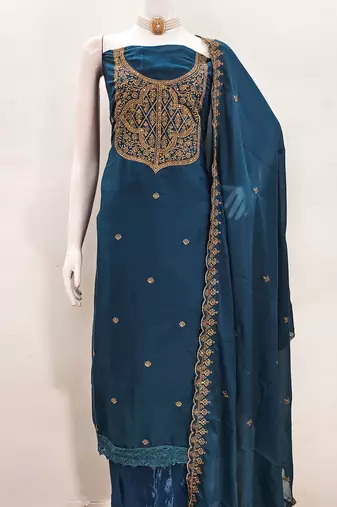 Graceful embroidered suit set featuring intricate zari work and a delicately bordered dupatta