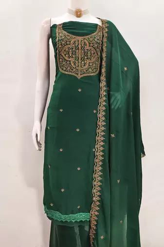 Graceful embroidered suit set featuring intricate zari work and a delicately bordered dupatta