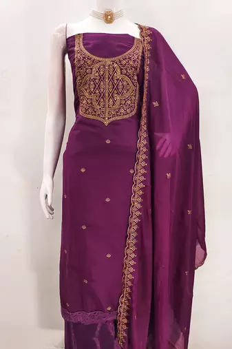 Graceful embroidered suit set featuring intricate zari work and a delicately bordered dupatta