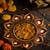 The handicraftian 9 diya plate