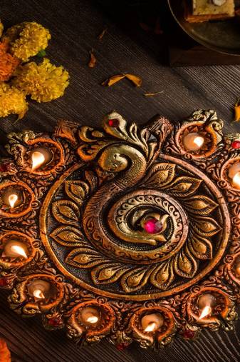 The handicraftian peacock 11 diya plate