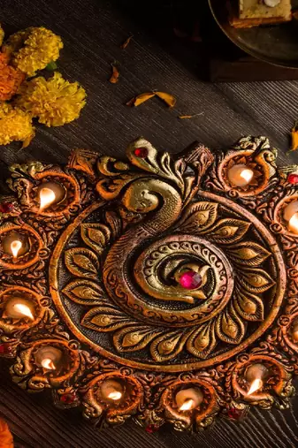 The handicraftian peacock 11 diya plate