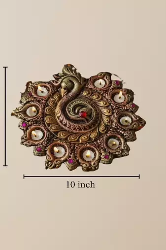 The handicraftian peacock 9 diya plate
