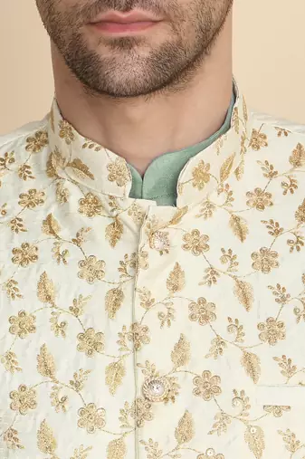 Silk blend solid olive green kurt and churidar with zari embroidered cream nehru jacket