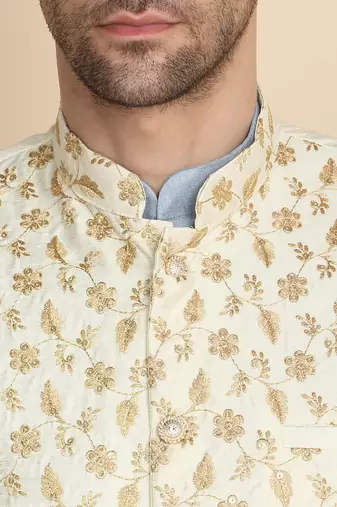 Silk blend solid sky blue kurta and churidar with zari embroidered cream nehru jacket