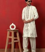 Cotton silk floral and zari embroidered cream kurta with salwar