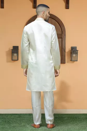 Cotton silk ethnic motifs embroidered cream kurta with trouser pant