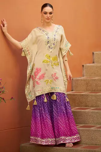 Cream chinnon  kaftan  suit with embroidery, sequins, mirror, gota & tassel work, free size stitched up to 42"