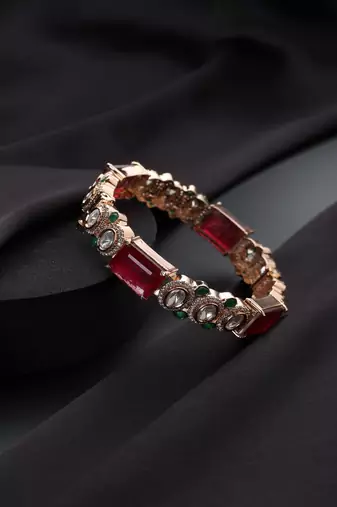 Gold plated kundan red stones bangle