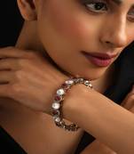 Gold plated kundan red stones bangle