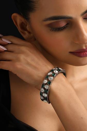 Gold plated Kundan green stones bangle
