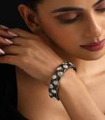 Gold plated Kundan green stones bangle