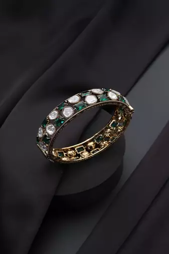 Gold plated Kundan green stones bangle