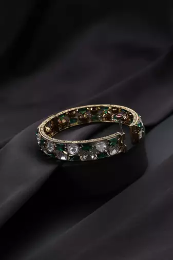 Gold plated Kundan green stones bangle
