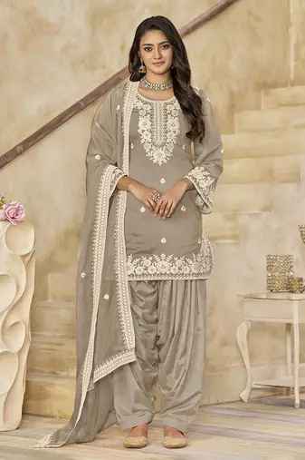 Dusty beige embroidered roman silk patiala suits
