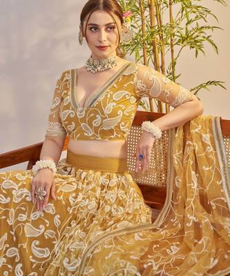 light golden Net With embroidered party wear lehenga choli 4