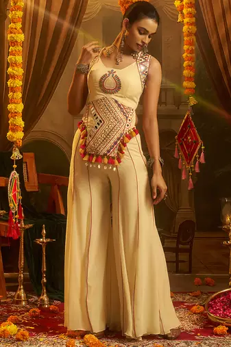 Cream georgette embroidered top with mirror, thread, tassels, shells and palazzo set