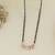 Rose gold plated traditional single line american diamond pendant with black bead chain mangalsutra for women (d106)