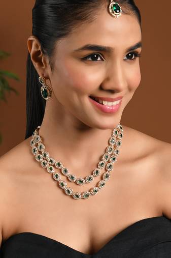 Gold plated stylish design crystal diamond oval shape necklace with earrings & maang tikka jewellery