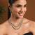 Gold plated stylish design crystal diamond oval shape necklace with earrings & maang tikka jewellery